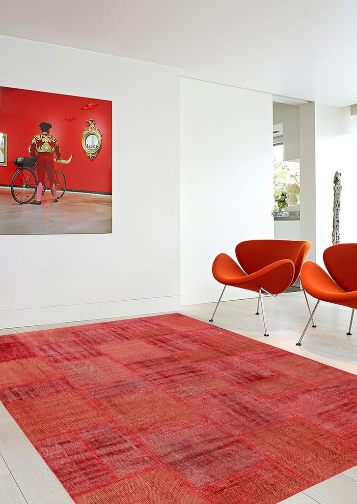 vintage patchwork overdyed red wool rug